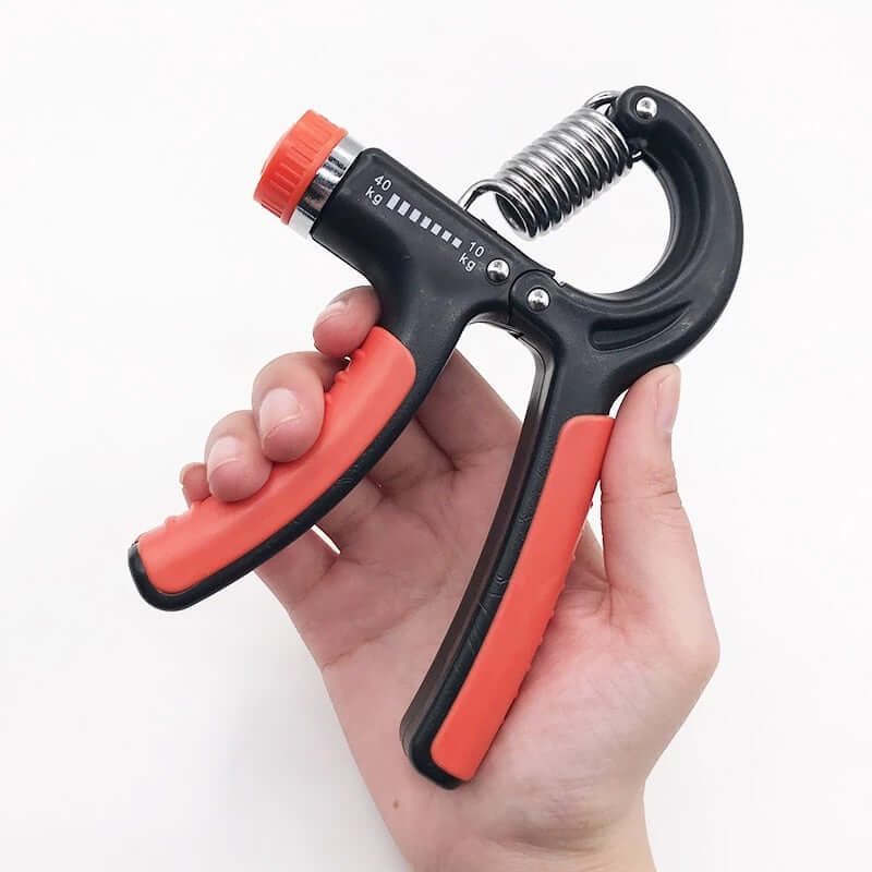 Adjustable resistance hand grip strength trainer in a hand for enhancing grip strength and finger flexibility.