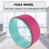 Yoga Pilates Circle Wheel in pink and teal for improved balance, posture, and flexibility during workouts.