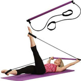 Woman exercising with Pilates Stick Squat Training Bar and bands on a yoga mat, targeting multiple muscle groups.