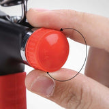 Close-up of hand adjusting the resistance knob on an adjustable hand grip strength trainer.