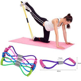 Woman exercising with yoga elastic rubber rope, showcasing strength training with colorful resistance bands.